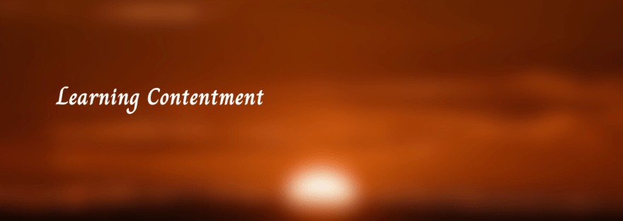 sunrise, red sky, with the words "learning contentment"